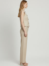 Blusa sin mangas con cuello redondo y doble fila de botones 