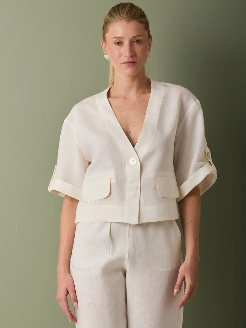 Blusa blithe Blanco con botones frontales y manga suelta ideal para un look minimalista.